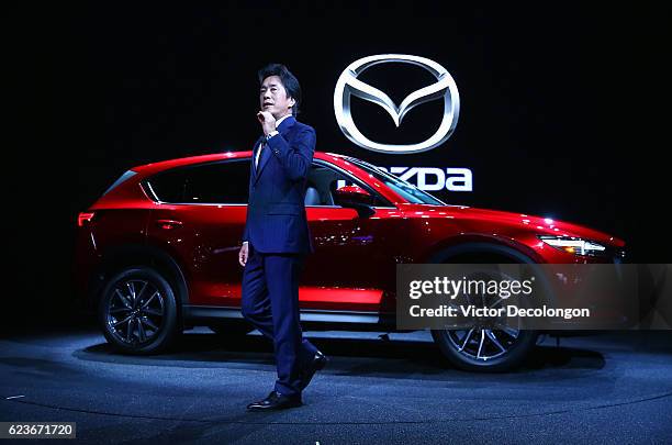 Masa Moro, President and CEO, Mazda North American Operations, speaks onstage at the Mazda press conference event at the L.A. Auto Show on November...