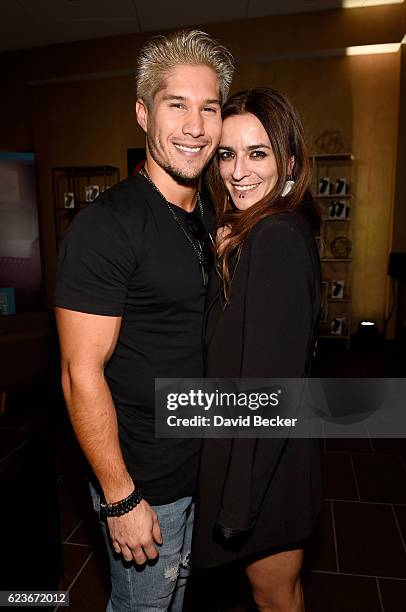 Musician Jesus Alberto Miranda Perez of Chino & Nacho and singer Bebe attend the gift lounge during the 17th annual Latin Grammy Awards at T-Mobile...