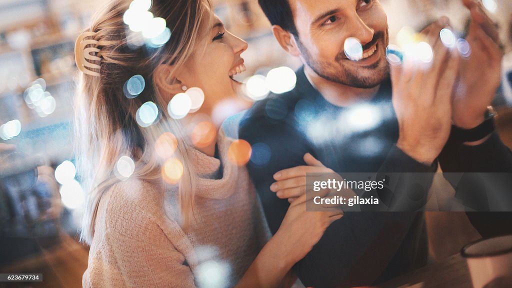 Couple having fun at coffee house.