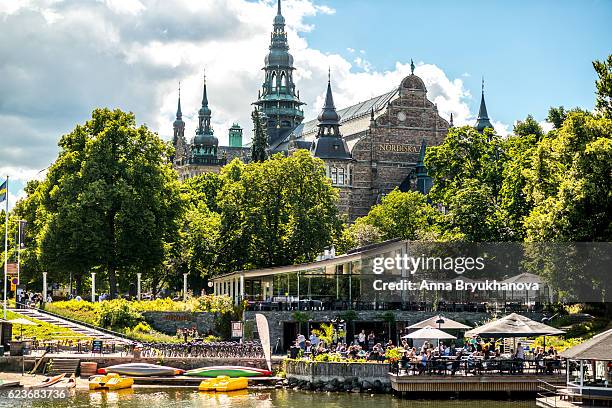 nordiska museum and people enjoying summer, stockholm, sweden - djurgarden stock pictures, royalty-free photos & images