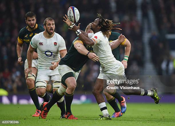Marland Yarde of England is tackled by Vincent Koch of South Africa during the Old Mutual Wealth Series match between England and South Africa at...