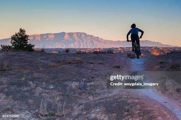 mountain biking man landscape - sandia mountains stockfoto's en -beelden