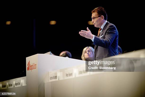 Andrew Mackenzie, chief executive officer of BHP Billiton Ltd., gestures as he speaks during the company's annual general meeting in Brisbane,...