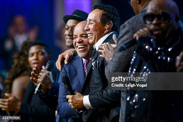 Smokey Robinson and Berry Gordy hug on stage during the 2016 Gershwin Prize For Popular Song at DAR Constitution Hall on November 16, 2016 in...