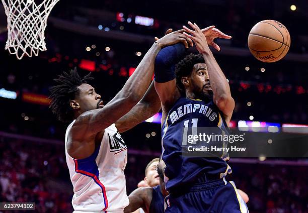Mike Conley of the Memphis Grizzlies and DeAndre Jordan of the LA Clippers go after a rebound during a 111-107 Grizzlies win at Staples Center on...