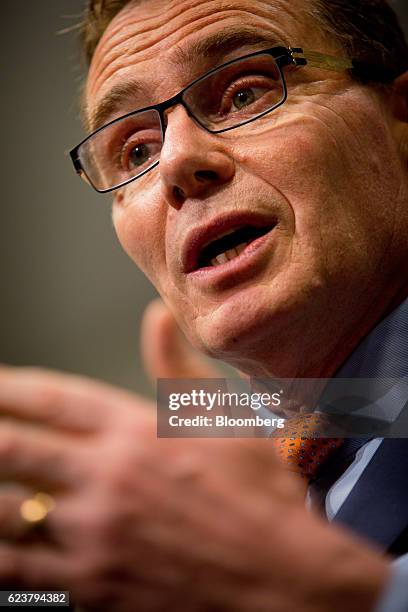 Andrew Mackenzie, chief executive officer of BHP Billiton Ltd., gestures as he speaks during a news conference following the company's annual general...