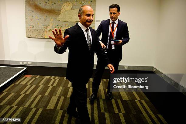 Jacques "Jac" Nasser, chairman of BHP Billiton Ltd., gestures as he leaves a news conference following the company's annual general meeting in...