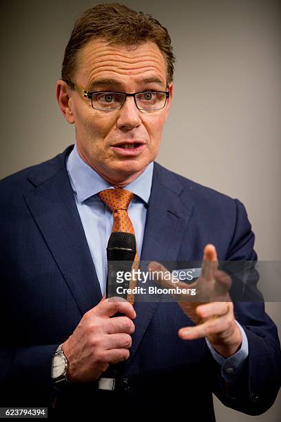 Andrew Mackenzie, chief executive officer of BHP Billiton Ltd., gestures as he speaks during a news conference following the company's annual general...