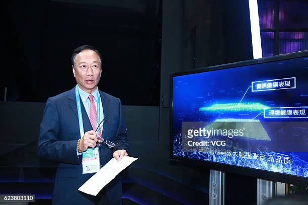 Terry Gou Tai-ming, founder and chairman of Taiwan's Foxconn Technology, speaks at the Foxconn booth during the 3rd World Internet Conference at...