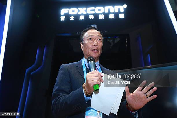 Terry Gou Tai-ming, founder and chairman of Taiwan's Foxconn Technology, speaks at the Foxconn booth during the 3rd World Internet Conference at...