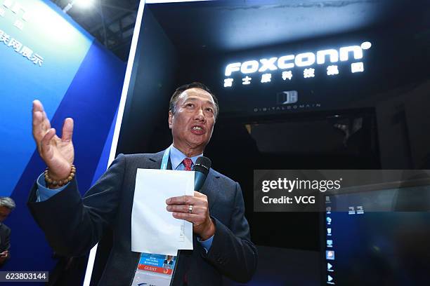 Terry Gou Tai-ming, founder and chairman of Taiwan's Foxconn Technology, speaks at the Foxconn booth during the 3rd World Internet Conference at...