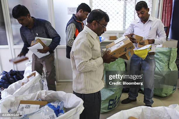 Workers sort packages at a Flipkart Online Services Pvt office in the Jayaprakash Narayan Nagar area of Bengaluru, India, on Wednesday, Oct. 26,...