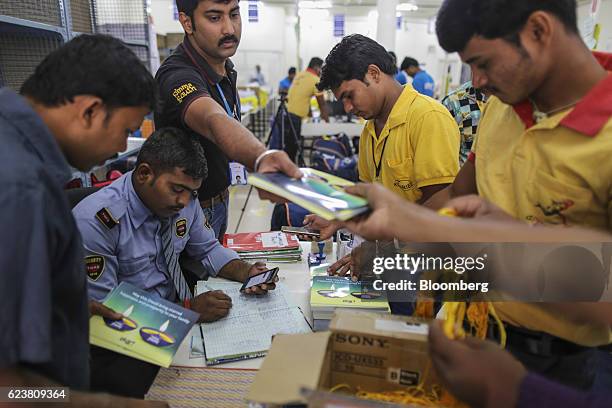 Employees collect Diwali greeting cards at a security desk ahead of delivery at the Flipkart Online Services Pvt office in the Jayaprakash Narayan...