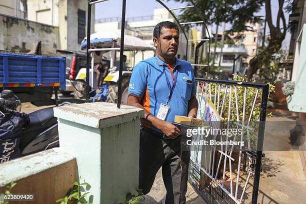 Abdul Saleem, a deliveryman known as a Wishmaster for Flipkart Online Services Pvt's Ekart Logistics service, delivers a package to a home in...