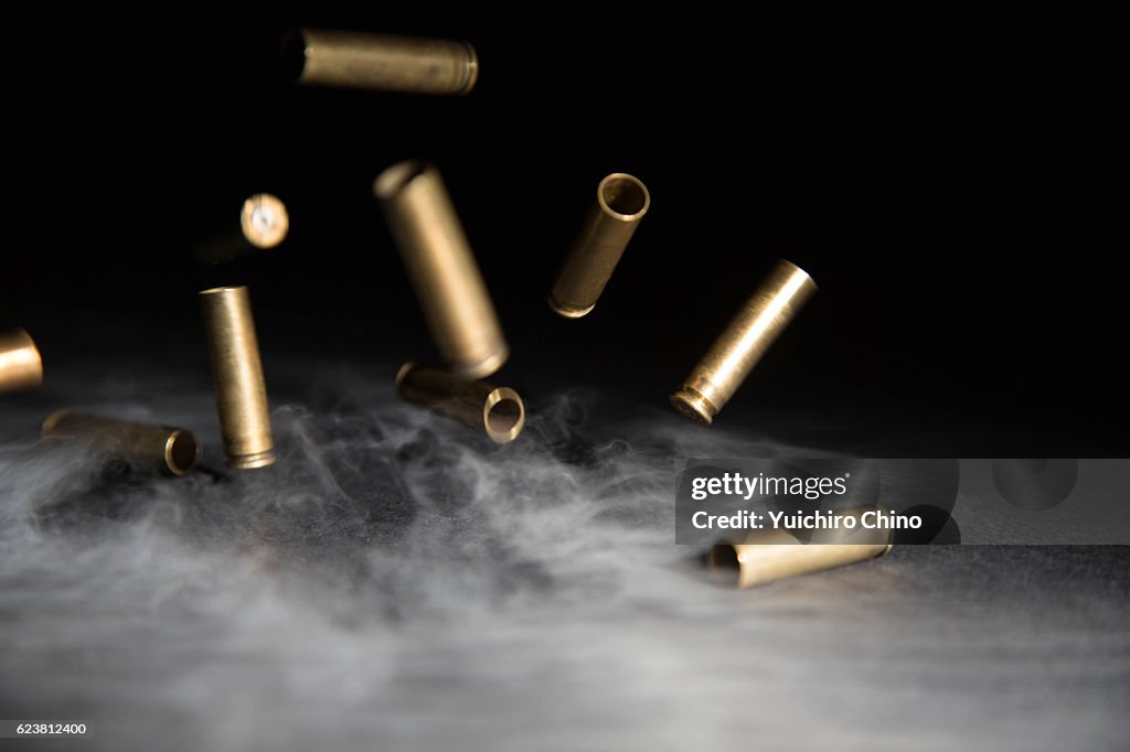 Smoking Bullets Falling on Ground