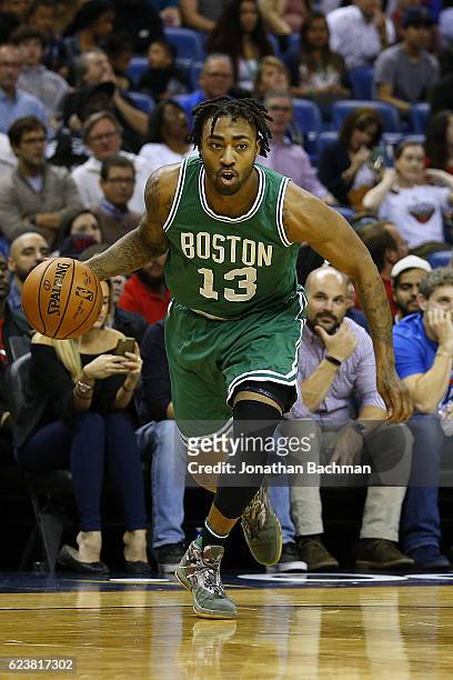 James Young of the Boston Celtics drives with the ball during a game against the New Orleans Pelicans at the Smoothie King Center on November 14,...