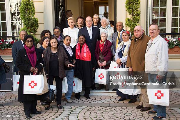 Prince Albert II of Monaco and Princess Charlene of Monaco attend the Parcels Distribution At Monaco Red Cross Headquarters on November 17, 2016 in...