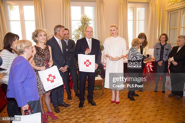 Prince Albert II of Monaco and Princess Charlene of Monaco attend the Parcels Distribution At Monaco Red Cross Headquarters on November 17, 2016 in...