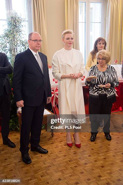 Prince Albert II of Monaco and Princess Charlene of Monaco attend the Parcels Distribution At Monaco Red Cross Headquarters on November 17, 2016 in...