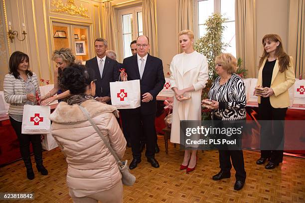 Prince Albert II of Monaco and Princess Charlene of Monaco attend the Parcels Distribution At Monaco Red Cross Headquarters on November 17, 2016 in...