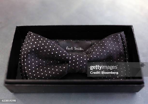 Black polka dot silk bow tie sits in a presentation box on display inside the Paul Smith Ltd. Boutique at the GUM department store on Red Square in...