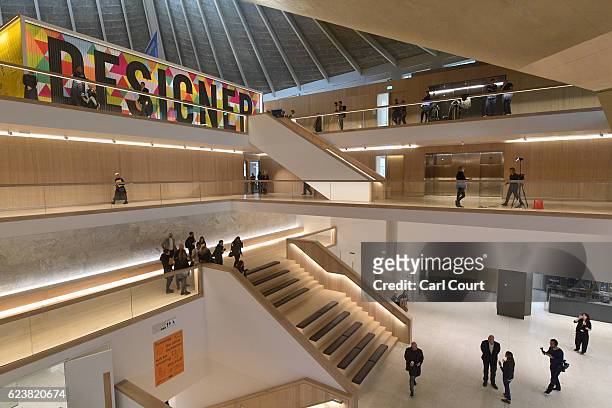 Visitors explore the new Design Museum during a media preview ahead of its official opening later this month, on November 17, 2016 in London,...