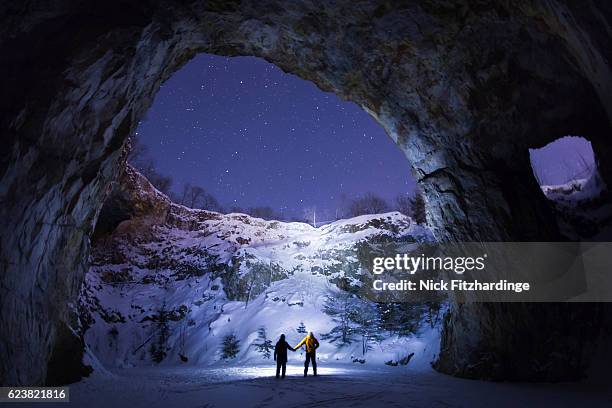 two people holding hands in an an underground cavern, wallingford back mine, quebec, canada - quebec stock pictures, royalty-free photos & images