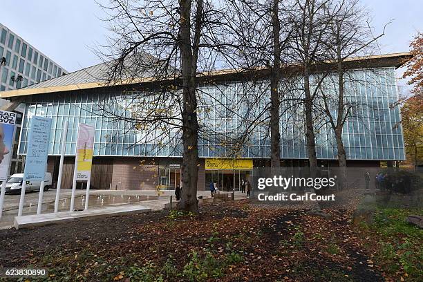 Visitors stand outside the new Design Museum during a media preview ahead of its official opening later this month, on November 17, 2016 in London,...