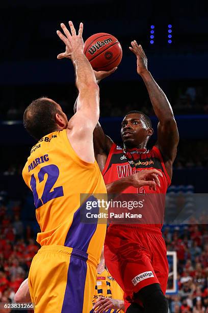 Casey Prather of the Wildcats lays up against Aleks Maric of the Kings of the Kings during the round seven NBL match between the Perth Wildcats and...