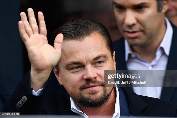 Hollywood actor Leonardo DiCaprio waves as he departs Home restaurant during his first visit on November 17, 2016 in Edinburgh, Scotland. The Oscar...