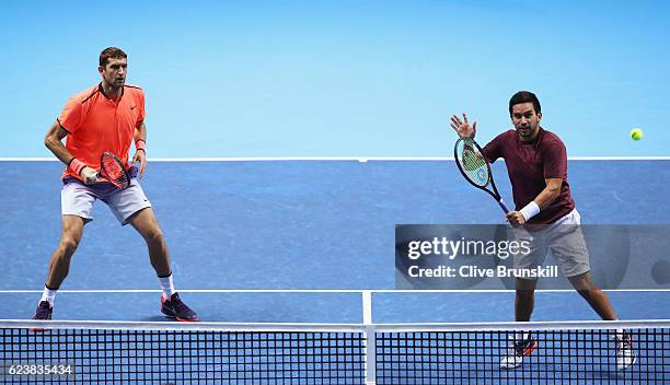 Max Mirnyi of Belarus and Treat Huey of Philippines in action in their men's doubles match against Bob Bryan and Mike Bryan of the United States on...