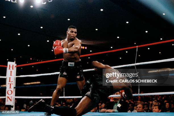 Challenger Mike Tyson knocks his opponent, heavyweight champion Trevor Berbick to become the youngest heavyweight world champion in history on...