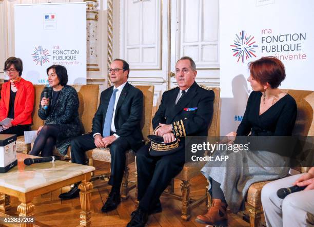 French President Francois Hollande and French Minister of the Civil Service Annick Girardin and Rhone-Alpes' prefect Michel Delpuech attend a meeting...