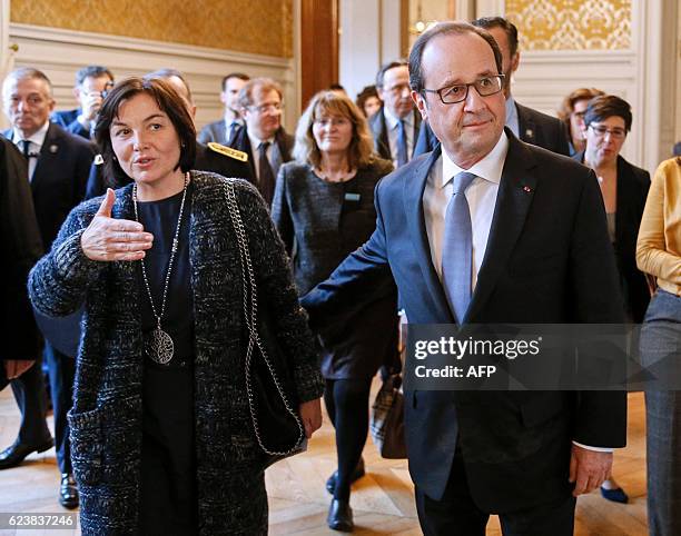 French President Francois Hollande and French Minister of the Civil Service Annick Girardin arrive at the Prefecture in Lyon, before a meeting on...