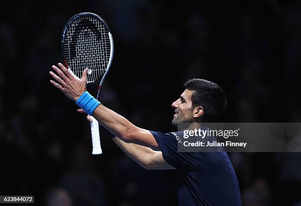 Novak Djokovic of Serbia celebrates victory in his men's singles match against David Goffin of Belgium on day five of the ATP World Tour Finals at O2...