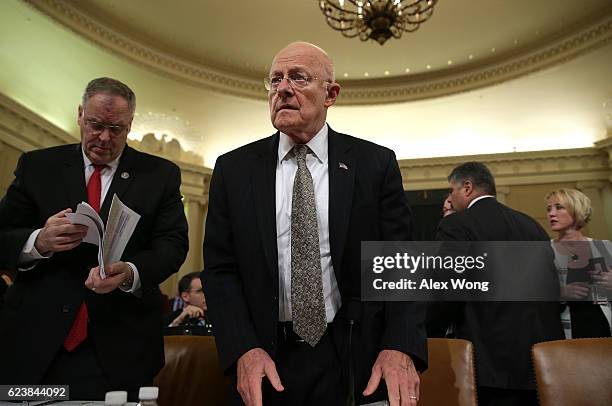 Director of National Intelligence James Clapper takes his seat as he arrives at a hearing before the House Intelligence Committee November 17, 2016...