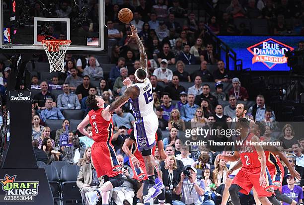 DeMarcus Cousins of the Sacramento Kings shoots over Omer Asik of the New Orleans Pelicans during an NBA basketball game at Golden 1 Center on...