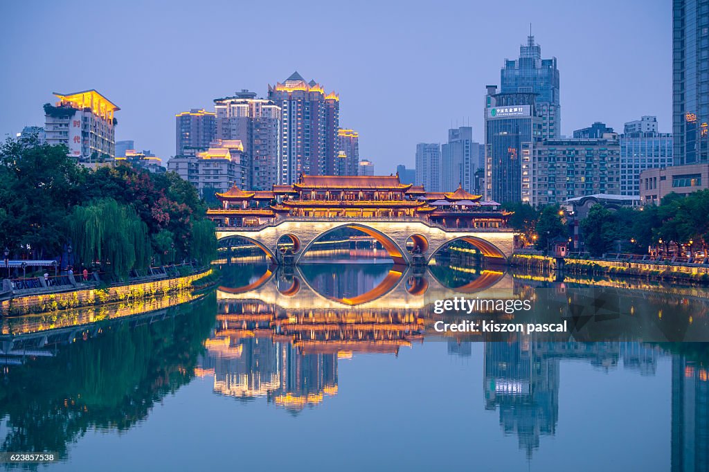 Illuminated Anshun Bridge with reflection, Chengdu