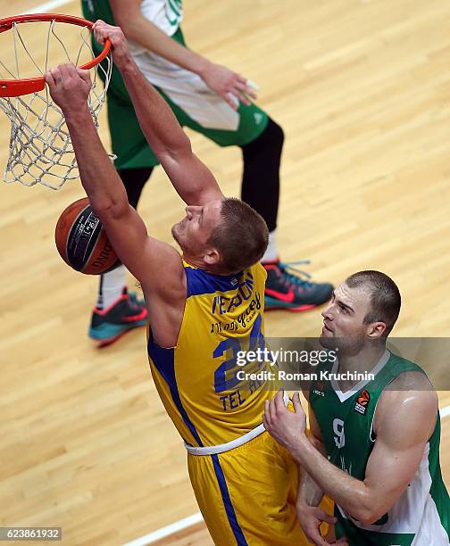 Colton Iverson, #24 of Maccabi Fox Tel Aviv competes with Artsiom Parakhouski, #9 of Unics Kazan during the 2016/2017 Turkish Airlines EuroLeague...