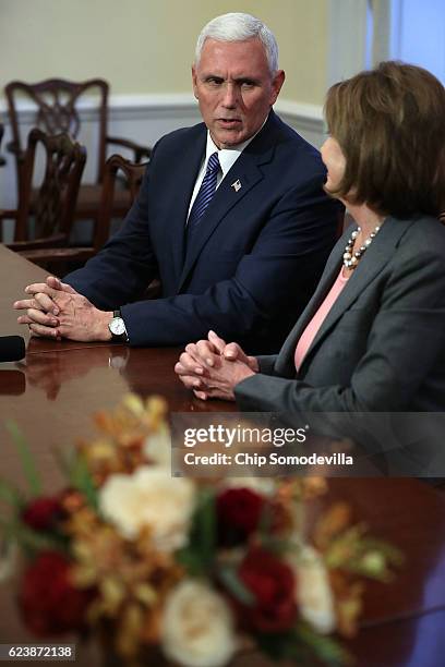 Vice President-elect Mike Pence and House Minority Leader Nancy Pelosi talk to reporters following their meeting in her offices at the U.S. Captiol...