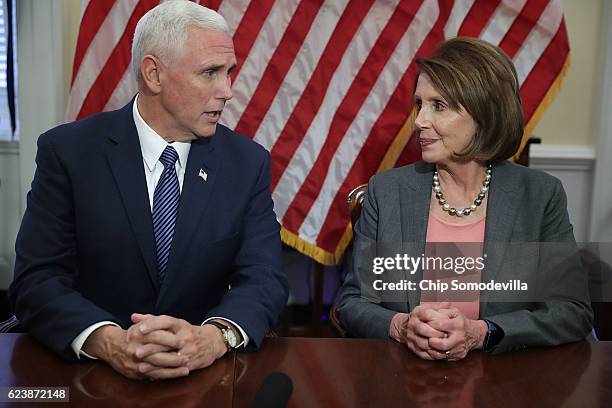 Vice President-elect Mike Pence and House Minority Leader Nancy Pelosi talk to reporters following their meeting in her offices at the U.S. Captiol...