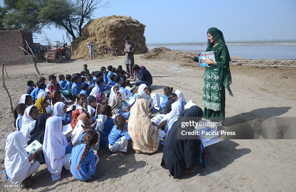 Pakistani students seen studying in a suburb of Lahore  as...