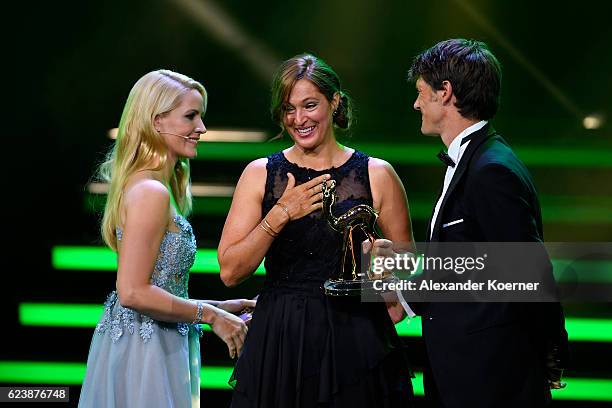 Judith Rakers, Saba Douglas-Hamilton and Frank Pope are on stage during the Bambi Awards 2016 show at Stage Theater on November 17, 2016 in Berlin,...