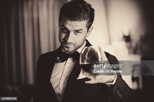 cheers to all - dinner jacket stock pictures, royalty-free photos & images