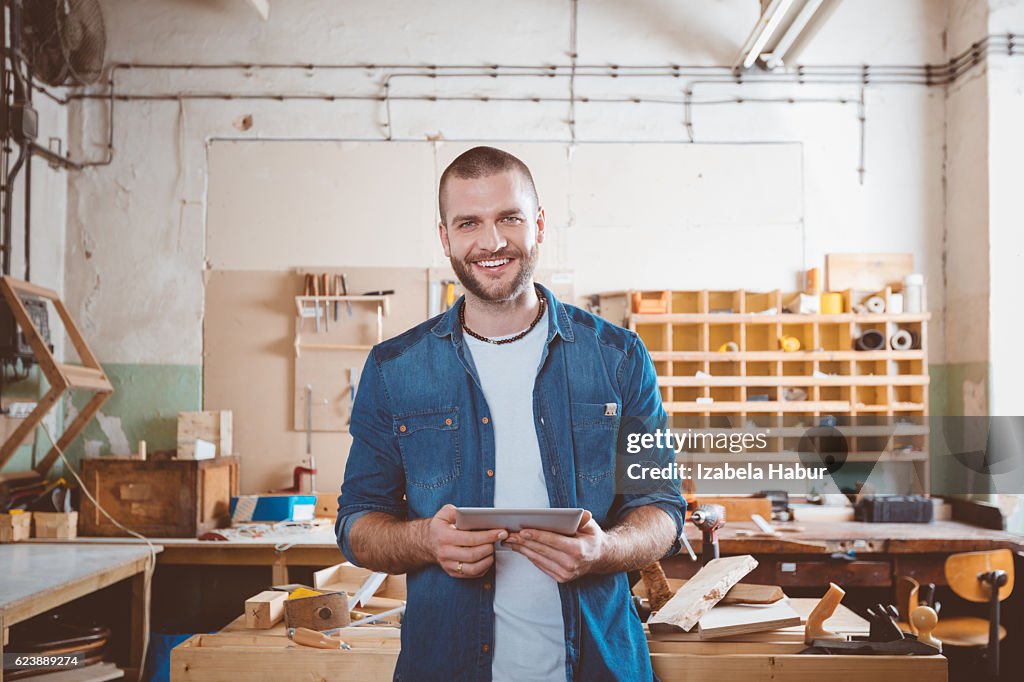 Young man in a carpentry workshop