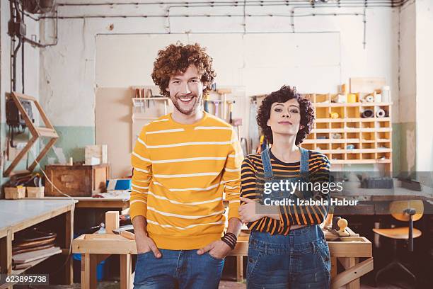 two carpenters in a construction workshop - repairman stock pictures, royalty-free photos & images