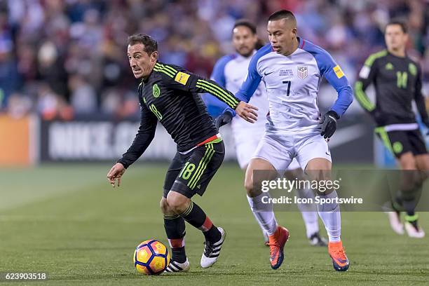 Mexico Men's National Team player Andres Guardado battles with United States Men's National Team player Bobby Wood for the ball in the first half...