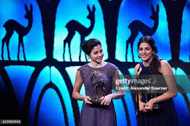 Yusra Mardini and Sarah Mardini are seen on stage during the Bambi Awards 2016 show at Stage Theater on November 17, 2016 in Berlin, Germany.
