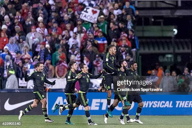 Mexico Men's National Team player Miguel Layun celebrates with Mexico Men's National Team player Carlos Vela and teammates after scoring a goal past...