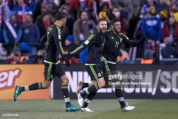 Mexico Men's National Team player Miguel Layun celebrates with Mexico Men's National Team player Carlos Vela and teammates after scoring a goal past...
